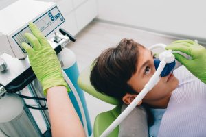 Teenager Receives Oxygen Mask Treatment in Hospital Setting